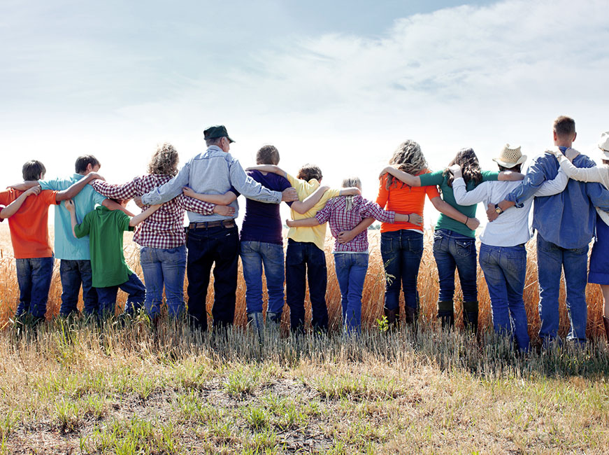People with arms around each others backs