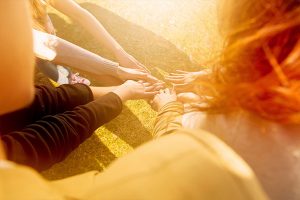 People putting hands together