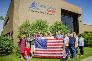GLE Employees holding an American flag