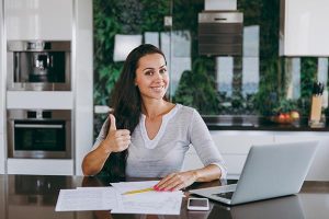 Woman giving thumbs up over new Great Lakes Energy bill format