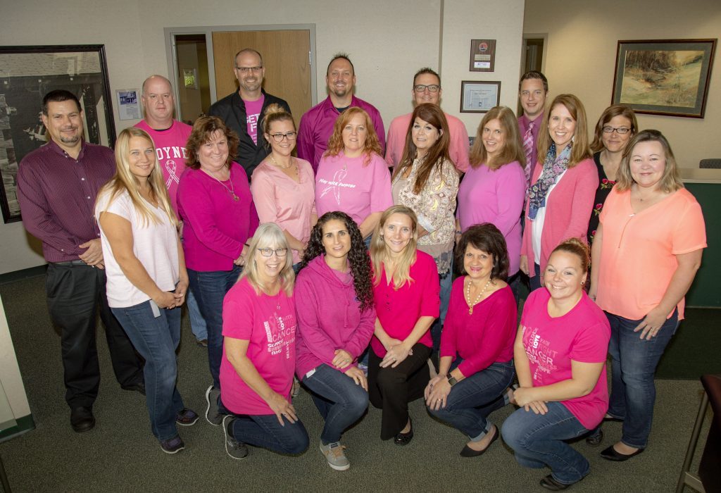 workers wearing pink