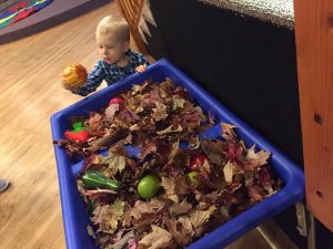 Toddler at harvest table, Sandcastles Childrens Museum