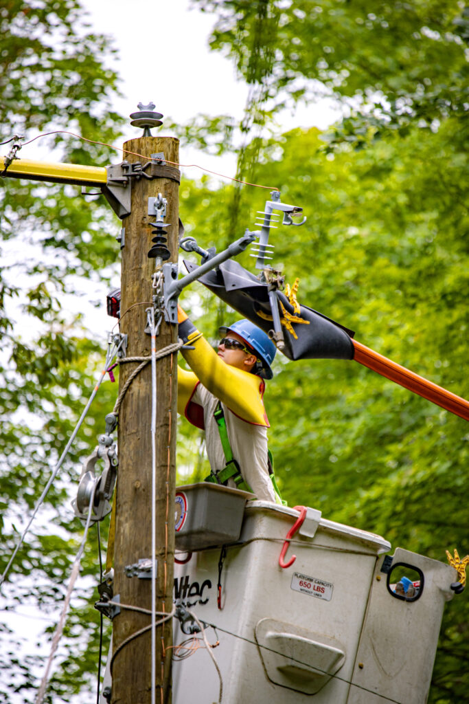 Lineworker working on a pole.