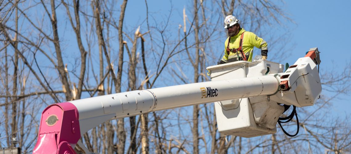Contractor working to restore power in northern Michigan over the weekend.