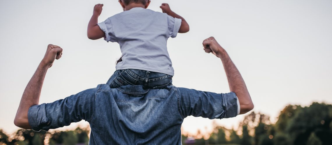 Dad and son having fun outdoors.