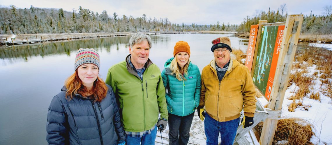 Standing on Grass
River Dock at the Grass River Natural Area, are (from left) executive director Jenn Wright, board member Rich Hannan, conservation director Emily Burke, and volunteer Kurt Cox.
