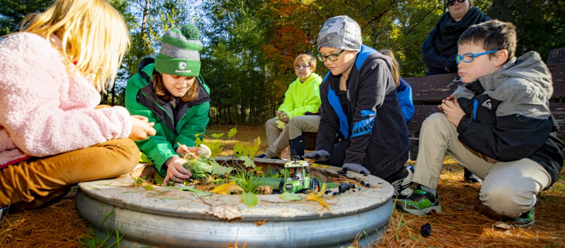 AmeriCorps worker Katherine Benedict leads a youth-focused educational program at the Pigeon River Discovery Center.