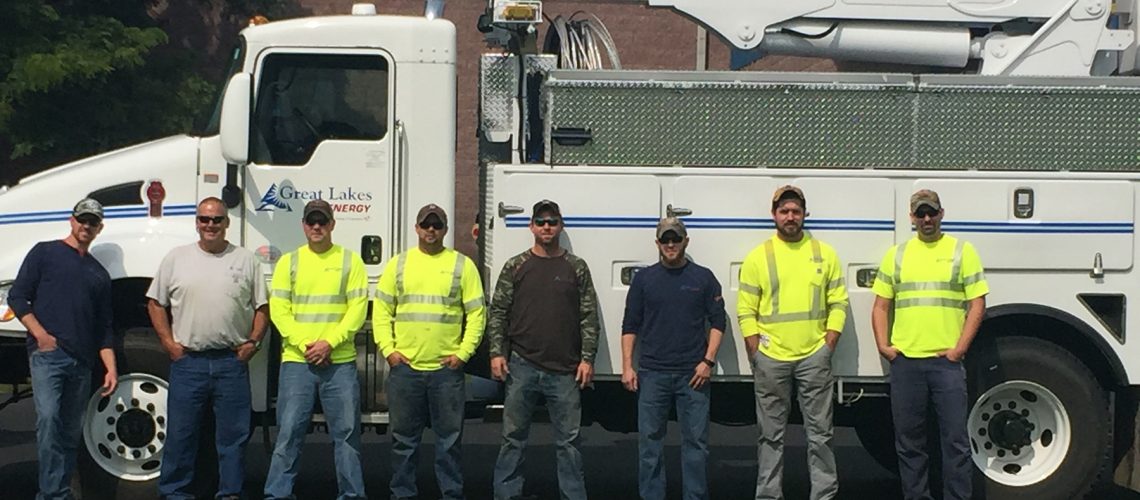 Men in front of bucket truck